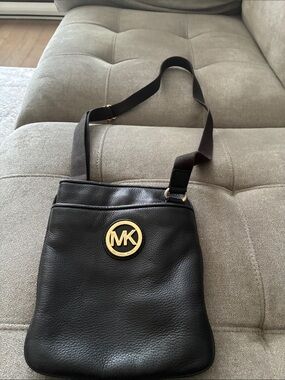 Michael Kors Black Leather Messenger Bag with Gold MK Medallion